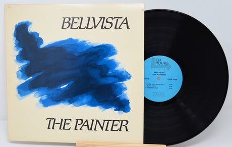 Vinyl record with a blue abstract design on the cover, featuring the text 'Bellvista The Painter'.