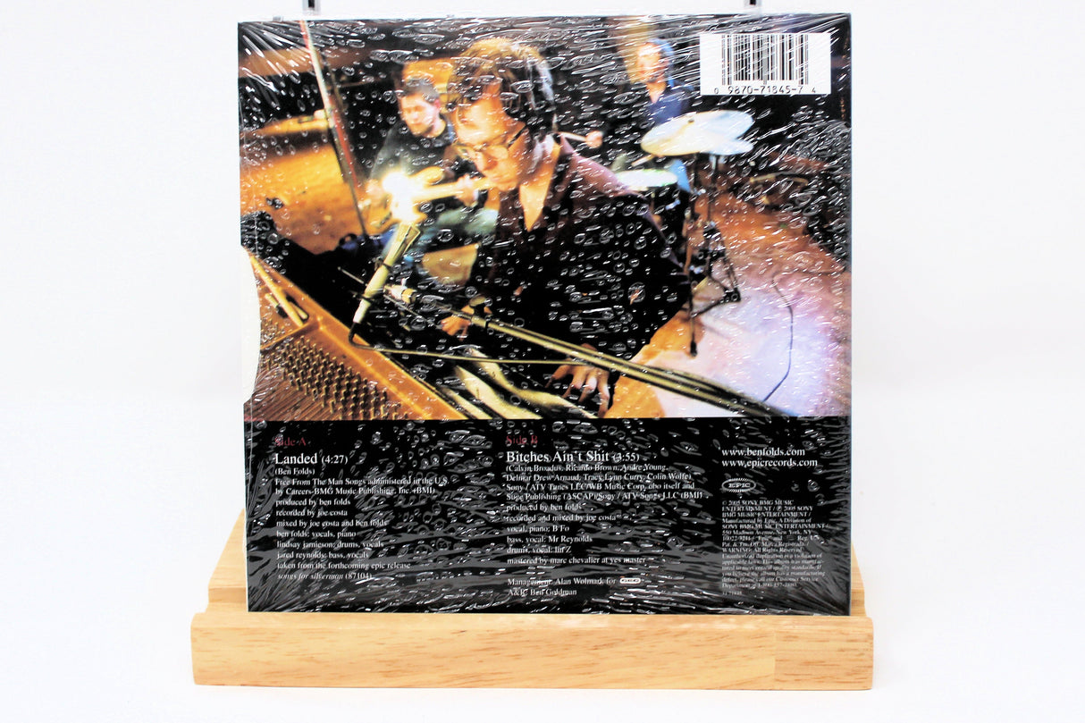 Back cover of Ben Folds Landed CD single showing band members in a recording studio