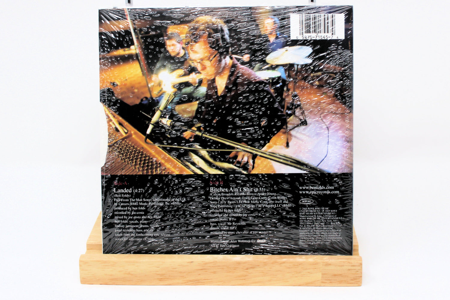 Back cover of Ben Folds Landed CD single showing band members in a recording studio