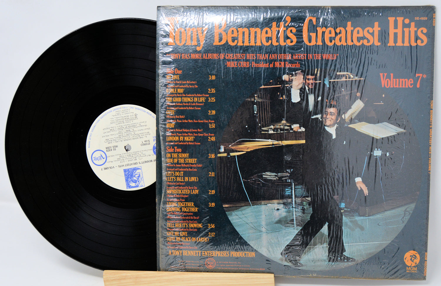 Vinyl record and cover of 'Tony Bennett's Greatest Hits Volume 7' on a white background