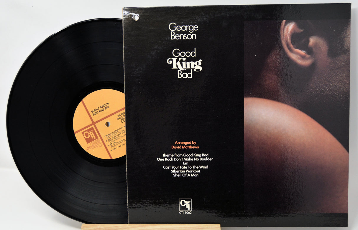 Vinyl record and cover of 'Good King Bad' by George Benson on a white background