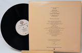 Vinyl record with a beige label and text on a white background