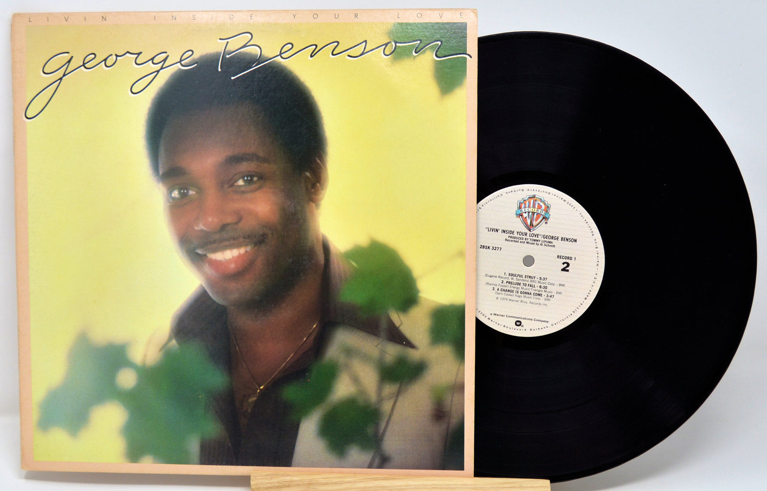 Vinyl record with cover featuring a person and album details