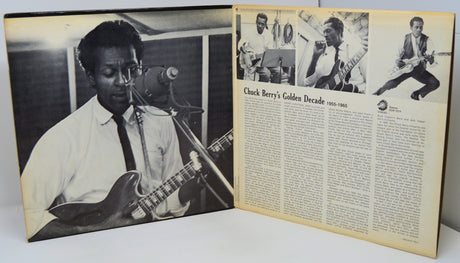 Album cover with black and white photo of a musician playing guitar and text on a white background