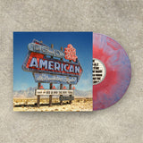Vinyl record with a cover featuring a desert scene and neon sign.