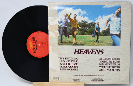 Vinyl record with a colorful cover featuring four people running, titled 'Heavens'.