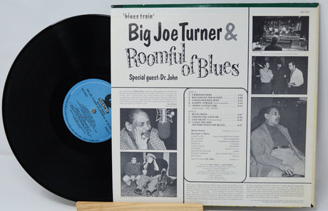 Vinyl record with its back cover featuring Big Joe Turner and Roomful of Blues on a white background