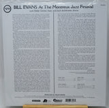 Back cover of a vinyl record for Bill Evans' 'At The Montreux Jazz Festival', showing track listings, credits, and a barcode on a white background.