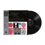 Vinyl record with cover featuring 'Interplay' by Bill Evans on a white background