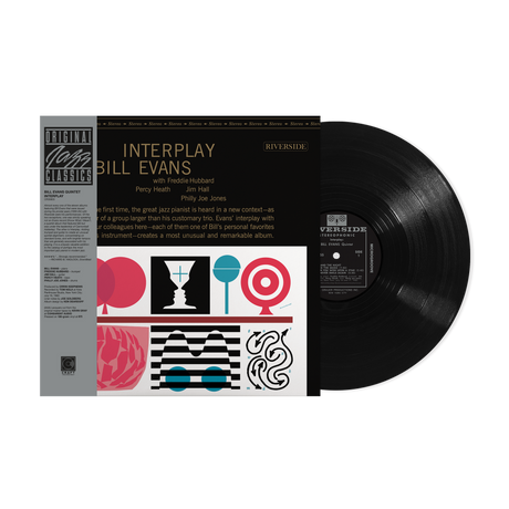 Vinyl record with cover featuring 'Interplay' by Bill Evans on a white background
