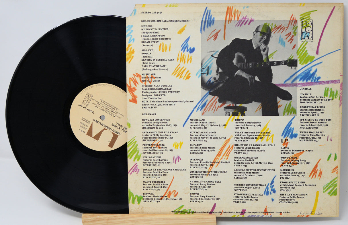 Vinyl record with colorful cover featuring a guitarist and text