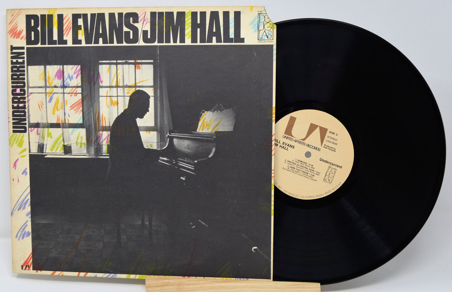 Vinyl record with cover featuring a silhouette of a person at a piano, titled 'Undercurrent' by Bill Evans and Jim Hall.