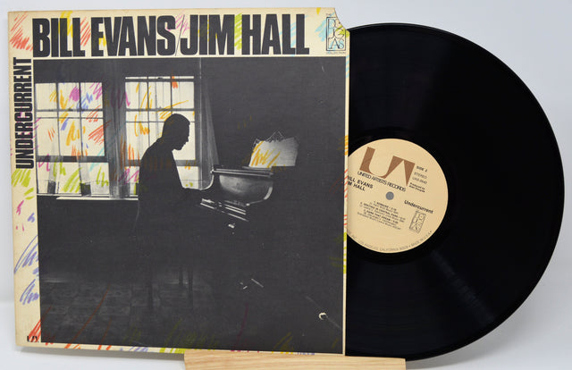 Vinyl record with cover featuring a silhouette of a person at a piano, titled 'Undercurrent' by Bill Evans and Jim Hall.