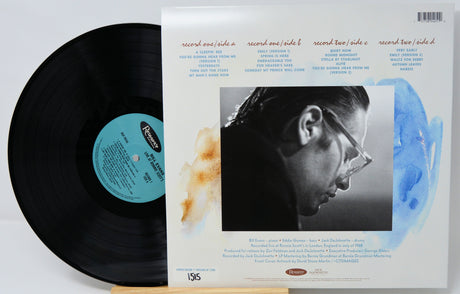 Back cover and vinyl record of Bill Evans Live at Ronnie Scott's, listing tracks and musicians, with Evans' portrait