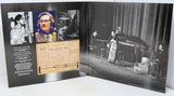 An open printed program or booklet displaying Bill Evans Trio concert photography and memorabilia, including a vintage ticket and black-and-white stage photos, set against a plain white background.