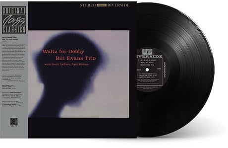 Vinyl record with cover featuring 'Waltz for Debby' by Bill Evans Trio on a white background