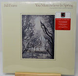 Bill Evans 'You Must Believe In Spring' LP album cover on a light cream background, featuring a black-and-white sketch of bare trees and a red CMT sticker on the right.