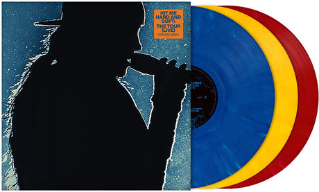 Vinyl records in blue, yellow, and red with a silhouette cover featuring Billie Eilish holding a microphone wearing a backwards baseball hat. 