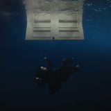 Billie Eilish 'Hit Me Hard And Soft' showing a person underwater looking up at a submerged door