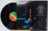 Vinyl record and cover with colorful neon signs on the cover