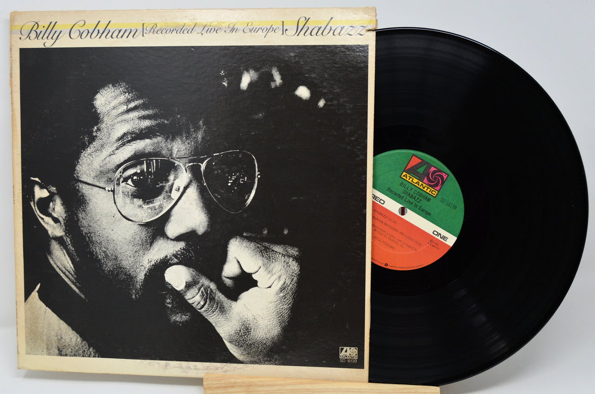 Vinyl record album 'Recorded Live in Europe's Shabbat' by Billy Cobham, showing the front cover with a black-and-white portrait and the black record partially pulled out on a light background.