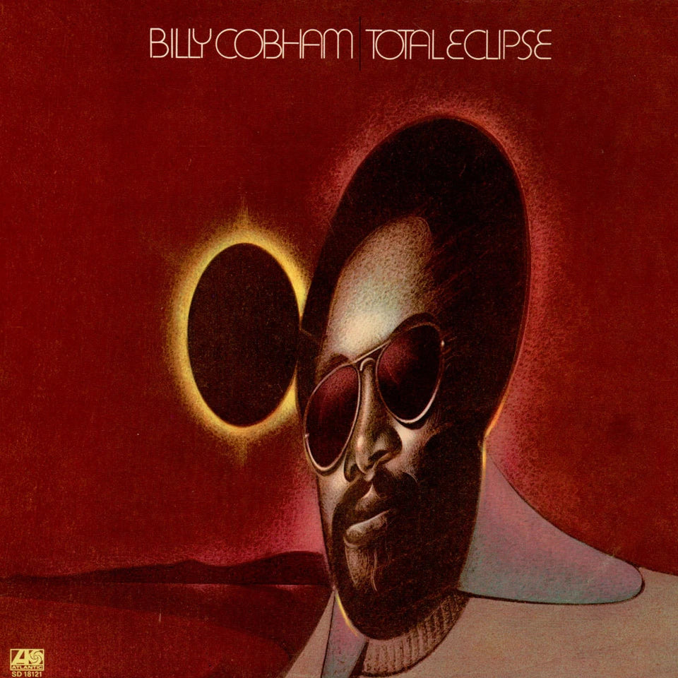Album cover with a stylized portrait of a person wearing sunglasses and an eclipse effect, featuring the text 'Billy Cobham Total Eclipse'.