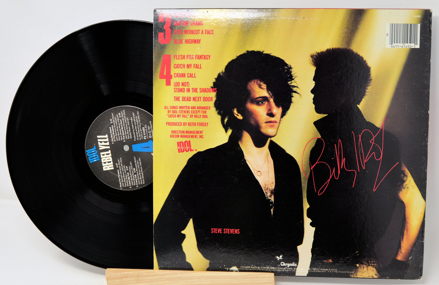 Vinyl record with cover featuring a silhouette of a person and text