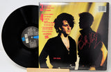Vinyl record with cover featuring a silhouette of a person and text