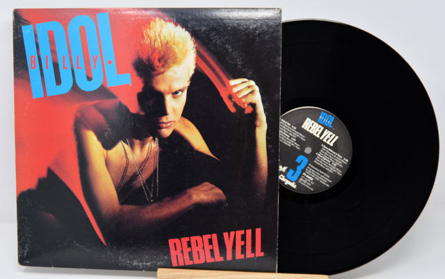 Vinyl record with cover featuring a person and 'Rebel Yell' text on a white background