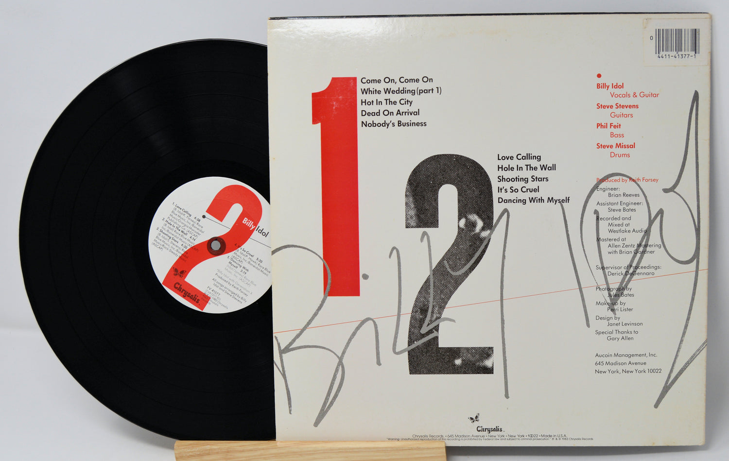 Vinyl record with cover displaying album art and text