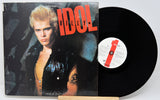 Vinyl record with cover featuring a person and the word 'IDOL' on a white background