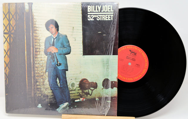 Vinyl record with '52nd Street' album cover featuring a person in a suit.