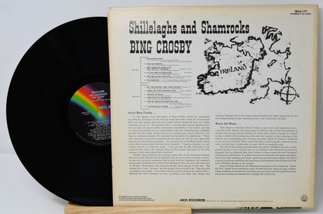 Vinyl record with cover featuring Bing Crosby's 'Shillelagh and Shamrocks' on a light gray background