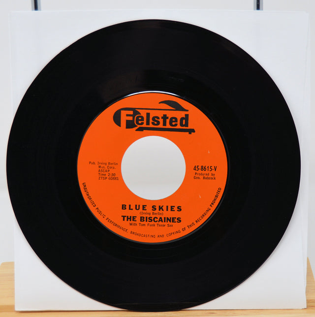 Vinyl record with orange label featuring 'Felsted' and 'Blue Skies' by 'The Biscaines'.