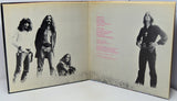 Album cover with black and white portraits and text on a white background