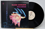Black Sabbath 'Paranoid' vinyl record with cover on a white background