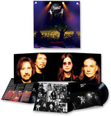 Vinyl record set with cover featuring band members and concert image, on a white background