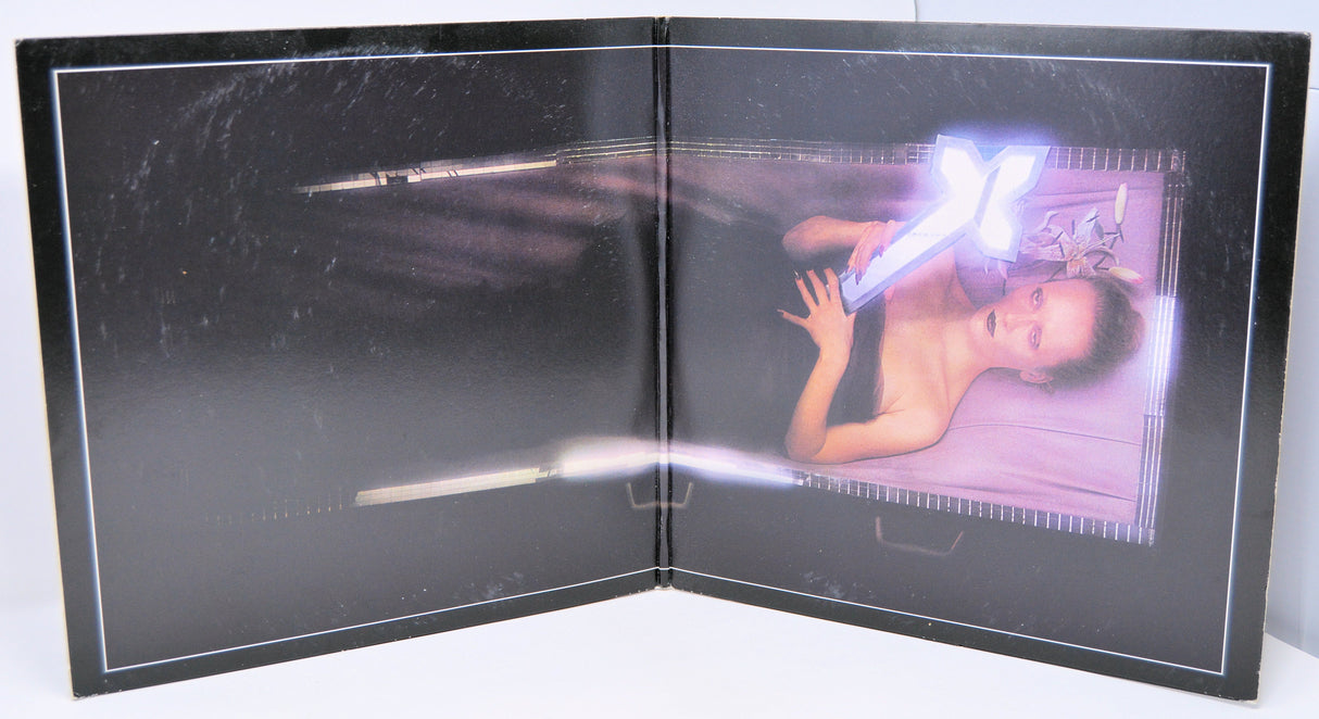 Artistic inner gatefold of Black Sabbath's We Sold Our Soul for Rock 'n' Roll album with neon cross imagery