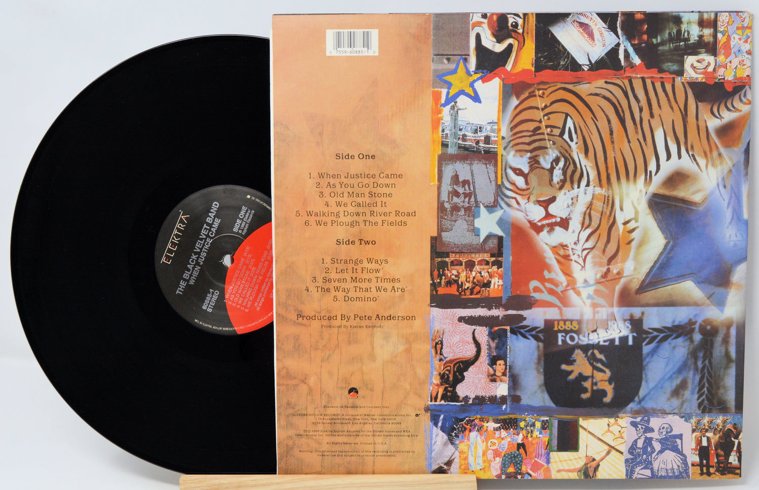 Vinyl record with a colorful album cover featuring a tiger and various images.