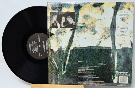 Vinyl record with a textured cover featuring images and text.