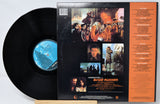 Vinyl record with 'Blade Runner' cover featuring images and text.