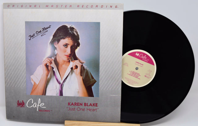 Vinyl record with cover featuring a woman and 'Cafe' branding