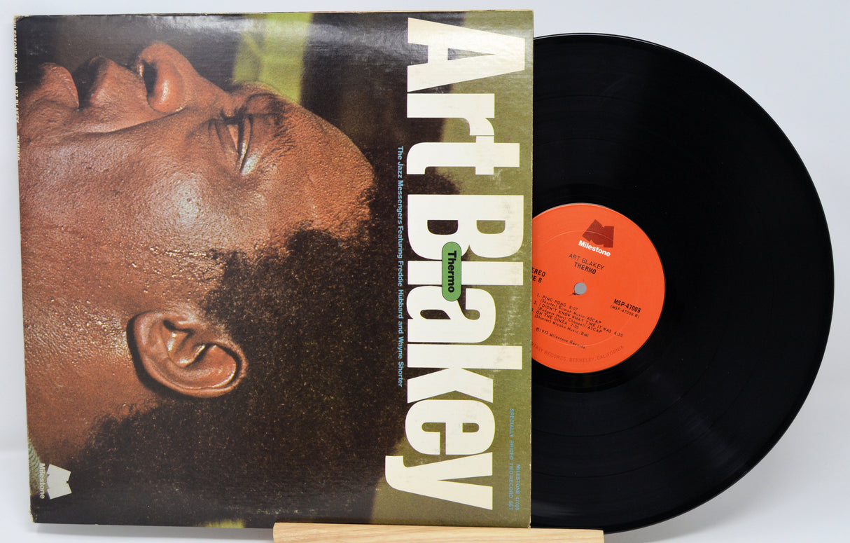 Vinyl record with cover featuring a close-up of a person's face and 'Art Blakey' text.