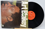 Vinyl record with cover featuring a close-up of a person's face and 'Art Blakey' text.
