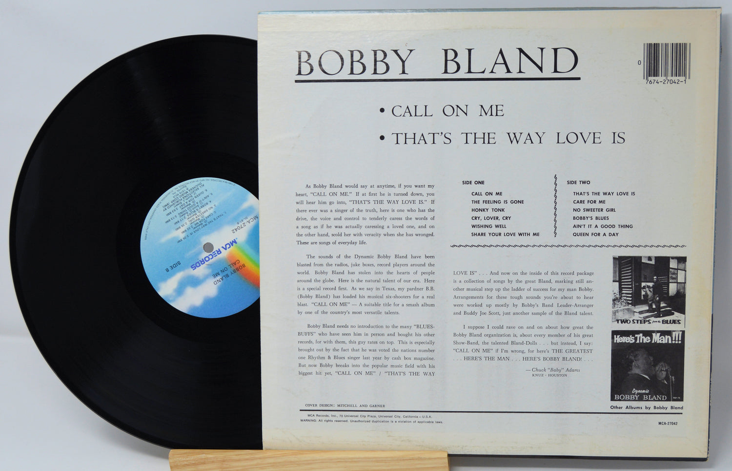 Vinyl record with cover featuring text and a rainbow label