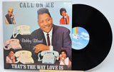 Vinyl record with cover featuring Bobby Bland and telephone imagery on a light blue background