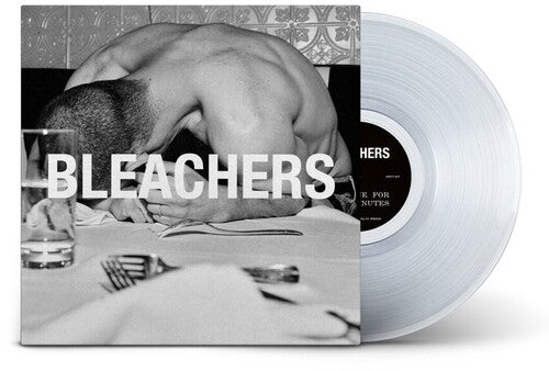 Vinyl record with 'BLEACHERS' album cover showing a person at a table.