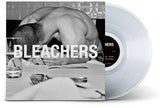 Vinyl record with 'BLEACHERS' album cover showing a person at a table.