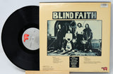Vinyl record with 'Blind Faith' album cover featuring a band photo.