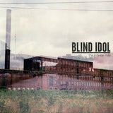 Blind Idol The Infinite Mile album cover featuring an abandoned brick factory with cloudy sky